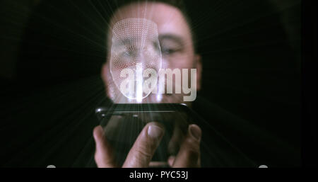 Gesichtserkennung hologramm Projektion von einem Mobiltelefon Stockfoto