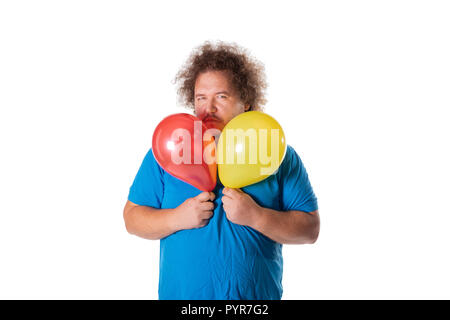 Funny Fat Man mit Luftballons. Alles Gute zum Geburtstag. Freude und Spaß Stockfoto