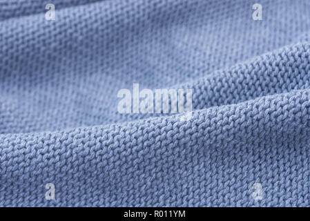 Blauer Pullover gewebter Stoff Textur Hintergrund selektiven Fokus Stockfoto