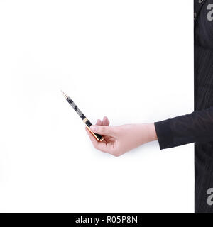 Hand des Business woman mit Stift auf einen Punkt, der auf dem leeren Bildschirm Stockfoto