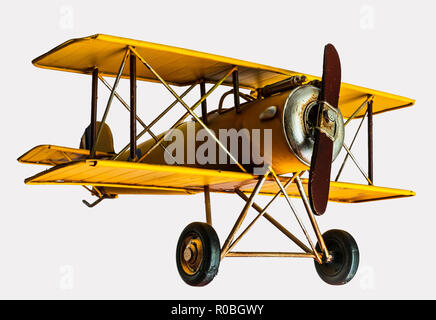 Gelb Spielzeug Flugzeug auf einem isolierten Hintergrund Stockfoto