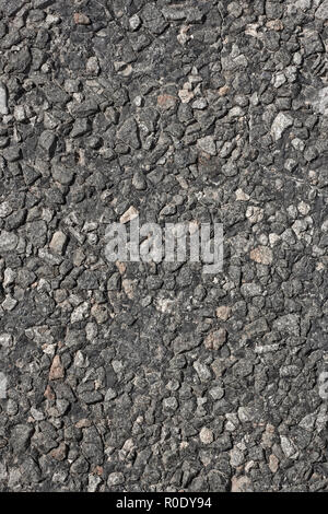 Fragment der asphaltierten Fahrbahn als Textur Nahaufnahme Stockfoto
