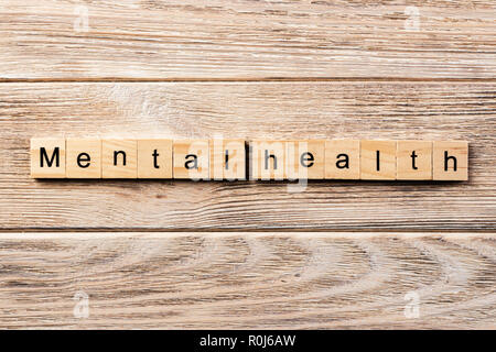 Psychische Gesundheit Wort auf Holz Block geschrieben. Psychische Gesundheit text auf Tisch, Konzept. Stockfoto