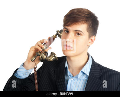 Portrait von attraktiven Mann sprechen für das drahtgebundene Telefon Stockfoto