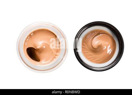 Jar und Kappe mit Tonalen bedeutet für das Gesicht auf einem weißen Hintergrund. Blick von oben. Stockfoto