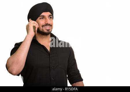 Junge glücklich Indischen Sikh Gespräch am Handy Stockfoto