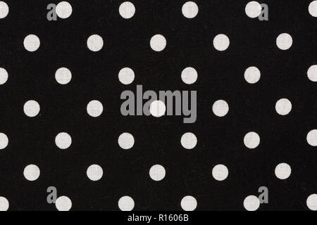Weiße Tupfen auf schwarzem Hintergrund. Polka Textur. Stockfoto