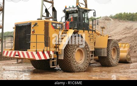 Eine Raupe mit Rädern laden Schaufel Arbeiten in einem Steinbruch in Leicestershire Stockfoto