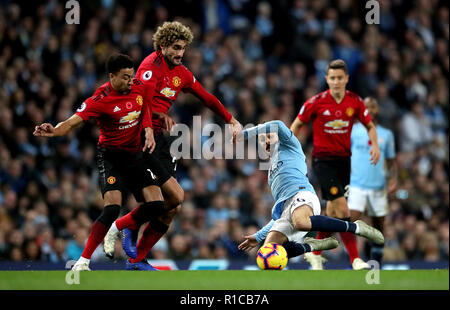 Von Manchester United Jesse Lingard (links), von Manchester United Balazs Fellaini (Mitte) und Manchester City Bernardo Silva (rechts) Kampf um den Ball während der Premier League Match an der Etihad Stadium, Manchester. Stockfoto