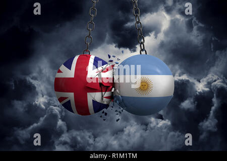 Großbritannien und Argentinien Flagge politische Kugeln smash in einander. 3D-Rendering Stockfoto