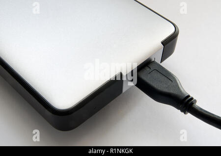Festplatte auf einem grauen Hintergrund closeup Stockfoto