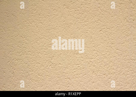 Gewöhnliche beige Pflasterwand Textur Hintergrund Stockfoto