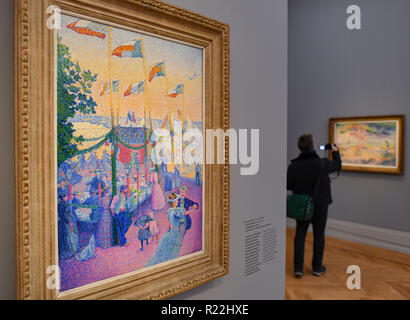 Potsdam, Deutschland. 16 Nov, 2018. Das Ölbild des Malers Henri-Edmond Cross "Dorffest in Var, 1896" ist auf dem Display im Barberini Museum in der neuen Ausstellung "Farbe und Licht. Die Neo-Impressionist Henri-Edmond Cross'. Die neue Ausstellung wird vom 17.11.2018 bis 17.02.2019. Foto: Patrick Pleul/dpa-Zentralbild/ZB/dpa/Alamy leben Nachrichten Stockfoto