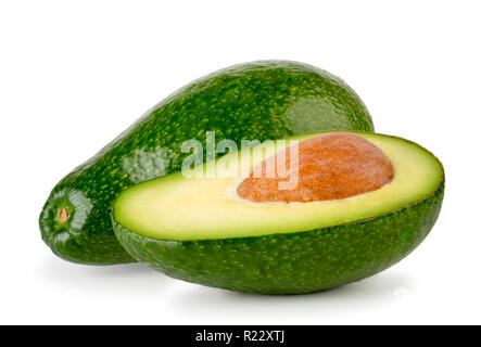 Reife avocado und Hälfte mit einem Knochen auf einem weißen. Isoliert. Stockfoto