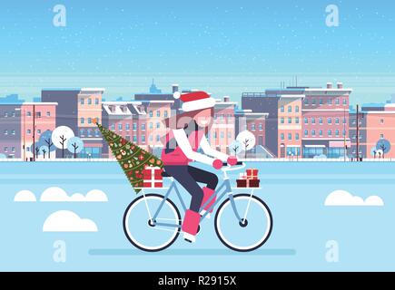 Frau Reiten Fahrrad mit Tannenbaum Geschenkbox über Stadt Straße Gebäude Stadtbild Hintergrund frohe Weihnachten Neujahr Konzept waagrechten Stock Vektor