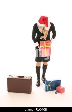 Frau mit stocking Cap, Gepäck, Geschenke Stockfoto