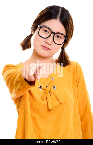 Studio shot der jungen schönen asiatischen Frau am Zeigefinger ca Stockfoto