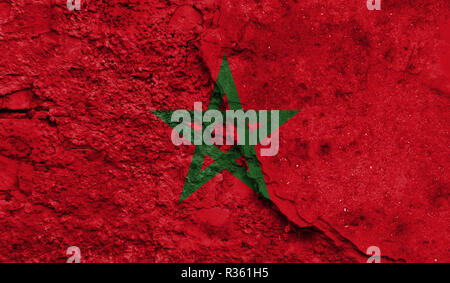 Flag of Morocco close up painted on a cracked wall, concept of armed actions and conflicts in the world Stockfoto