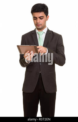 Jungen schönen persischen Geschäftsmann mit digitalen Tablet Stockfoto