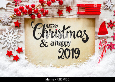 Papier mit Englisch Kalligraphie frohe Weihnachten und einen guten Rutsch ins Jahr 2019. Helle Weihnachten Dekoration wie Schlitten, Sterne, Schneeflocke und Santa Hut mit Schnee. Stockfoto