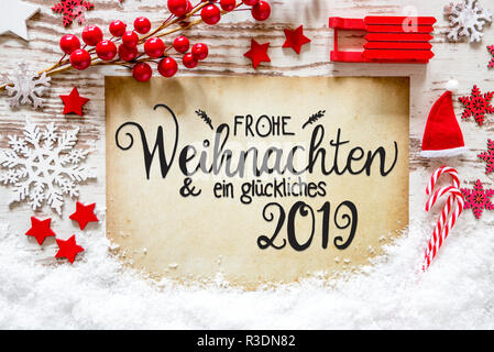 Papier mit Deutschen Kalligraphie Frohe Weihnachten und ein Glueckliches 2019 bedeutet, frohe Weihnachten und einen guten Rutsch ins Jahr 2019. Helle Weihnachten Dekoration wie Sle Stockfoto