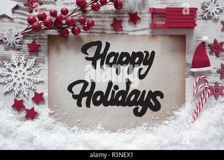 Papier mit Englisch Kalligraphie frohe Feiertage. Weihnachtsdekoration wie Schlitten, Sterne, Schneeflocke und Santa Hut mit Schnee. Stockfoto