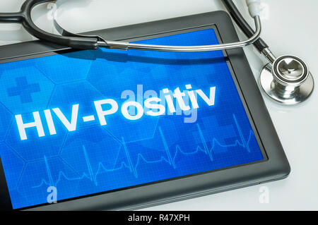 Tablet mit dem Text hiv positiv auf der Anzeige Stockfoto