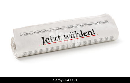 Zeitung mit der Überschrift wählen Sie jetzt Stockfoto