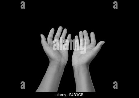 Hände auf schwarzem Hintergrund öffnen Stockfoto