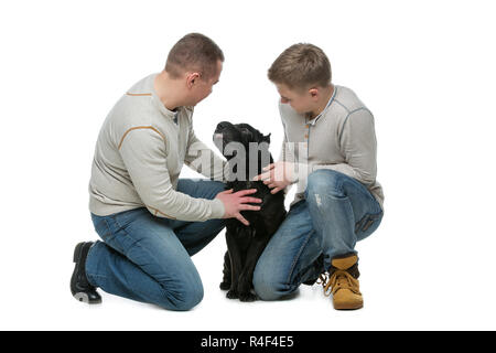 Vater mit Sohn und Hund Stockfoto