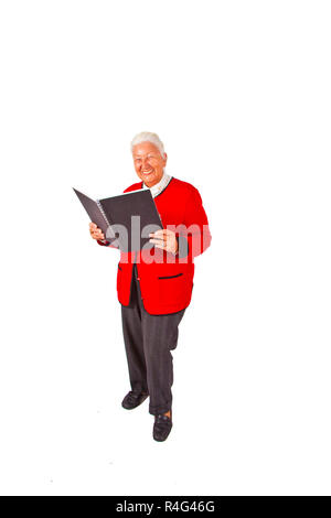Lächelnd attraktive ältere Frau in einem Buch lesend und eine Rede Stockfoto