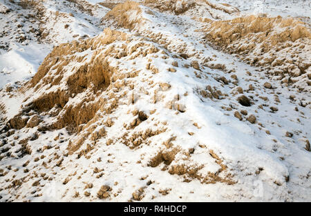 Sand unter dem Schnee Stockfoto