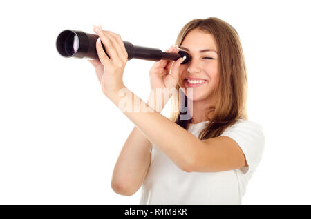 Junges Mädchen mit Teleskop auf weißem Hintergrund Stockfoto