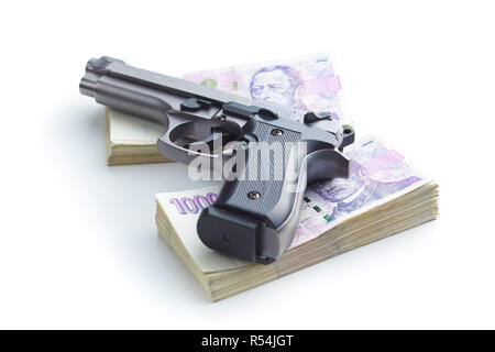 Pistole und Geld. Stockfoto