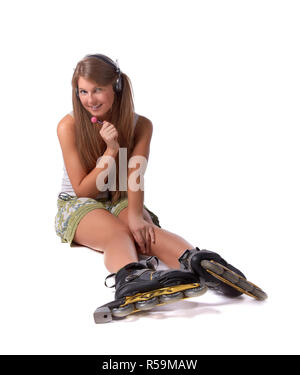 Das schöne Mädchen in rollerskates Stockfoto