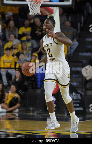 Wichita, Kansas, USA. 25 Nov, 2018. Wichita Zustand Shockers guard Jamarius Burton (2) bringt die Kugel oben Gericht während der NCAA Basketball Spiel zwischen den Reis Eulen und die Wichita State Shockers an Charles Koch Arena in Wichita, Kansas. Kendall Shaw/CSM/Alamy leben Nachrichten Stockfoto