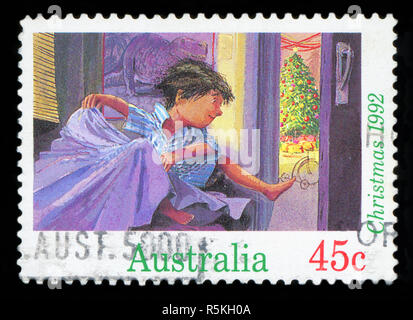 Australien - ca. 1992: einen Stempel in den Australien gedruckten zeigt Junge sprang vom Bett Weihnachten Morgen, Weihnachten, ca. 1992 Stockfoto