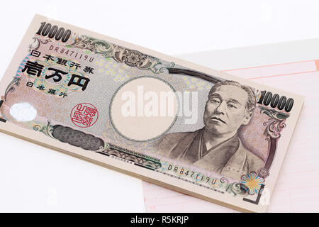 Japanische Geld und Sparbuch auf weißem backgroundã € € isoliert Stockfoto