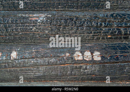 Textur von Verkohlten anmeldet. Verbrannte Holz verkohlte Haus Textur anmelden. closeup Stockfoto