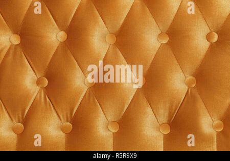 Golden textile capitone Hintergrund Textur Stockfoto