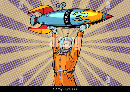 Astronaut Holding eine Weltraumrakete Stockfoto