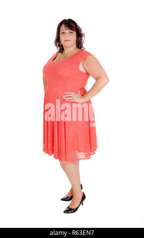 Ein plus Größe stehende Frau in einem Kleid Stockfoto