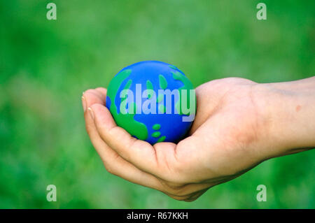 Globus in der Hand Stockfoto