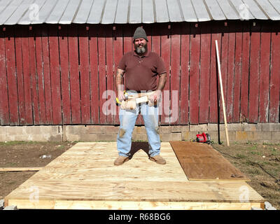 Schlamm gebeizt Arbeiter stehen auf der Plattform Stockfoto