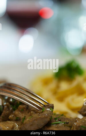 Gabel auf Fleisch Stockfoto