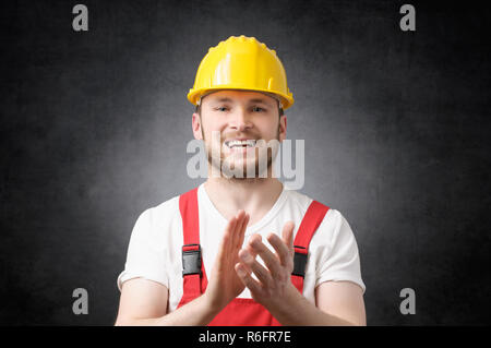 Bauarbeiter klatschte in die Hände Stockfoto