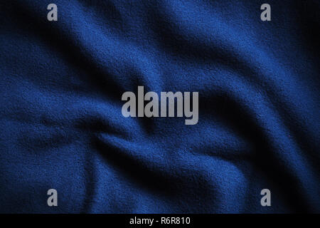 Textur von Deep Blue Fleece, weich Genoppt isolierenden Gewebe aus Polyester, wellenförmige Muster Stockfoto