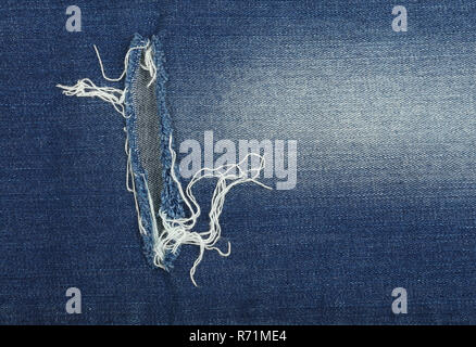 Blau gewaschen Jeans Denim Textur Hintergrund mit Bohrung Stockfoto