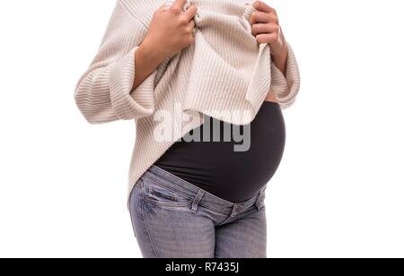 Jeans mit elastischem Einsatz für schwangere Frauen. Stockfoto