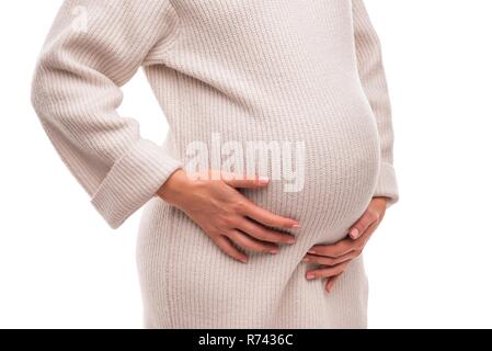 Abbildung einer schwangeren Frau in einem warmen Winter Pullover. Stockfoto